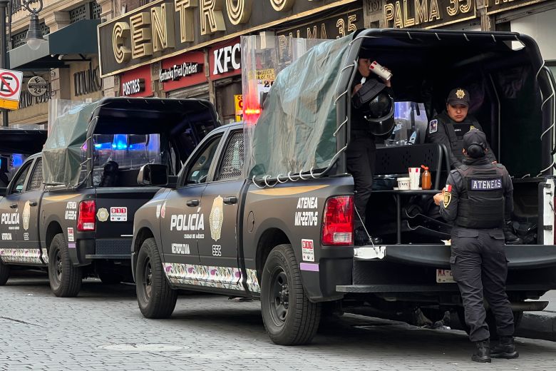 Security forces guard Mexico City's main plaza, El Zocalo, as construction crews set up a stage for a World Cup fan festival, on May 29, 2026.