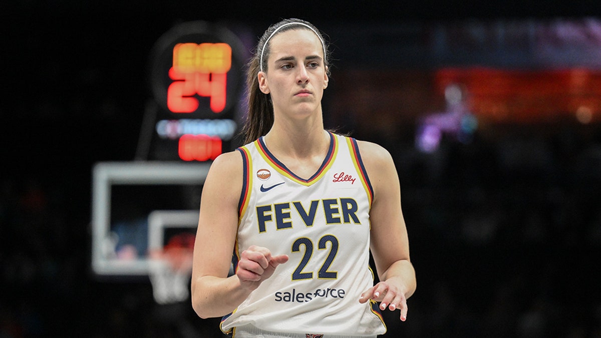 Indiana Fever guard Caitlin Clark dribbling basketball during game at Barclays Center