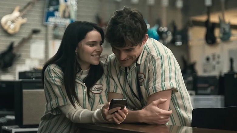 Michael Johnston as Bear Bailey and Inde Navarrette as Nikki Freeman hang out at a music store in Obsession