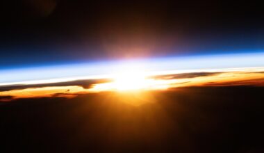 The last rays of an orbital sunset illuminate Earth's atmosphere and the cloud tops in this photograph from the International Space Station as it orbited 258 miles above the Pacific Ocean north of Papua New Guinea.