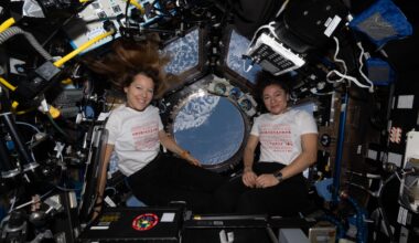 From left, Expedition 74 flight engineers Sophie Adenot of ESA (European Space Agency) and Jessica Meir of NASA pose for a portrait inside the International Space Station's cupola on Mother's Day. Adenot, who has a son, and Meir, who has a daughter, wear T-shirts celebrating motherhood.
