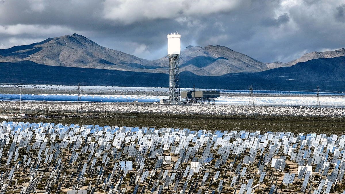 Ivanpah solar tower surrounded by mirrors in Mojave Desert