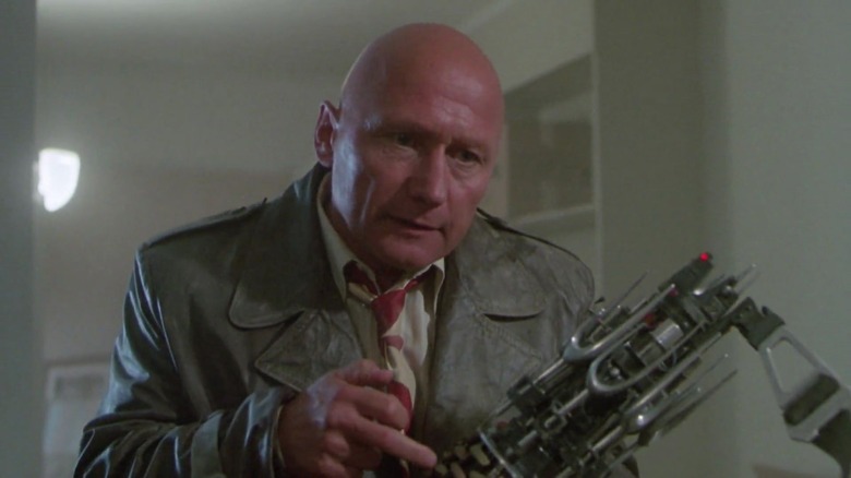 Detective Lubic holding a Cosmic Key in Masters of the Universe