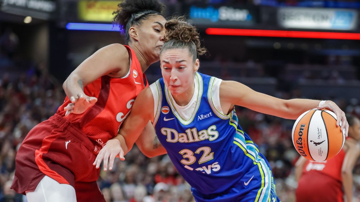 Jessica Shepard (32) of the Dallas Wings drives to the basket against Damiris Dantas (12) of the Indiana Fever.