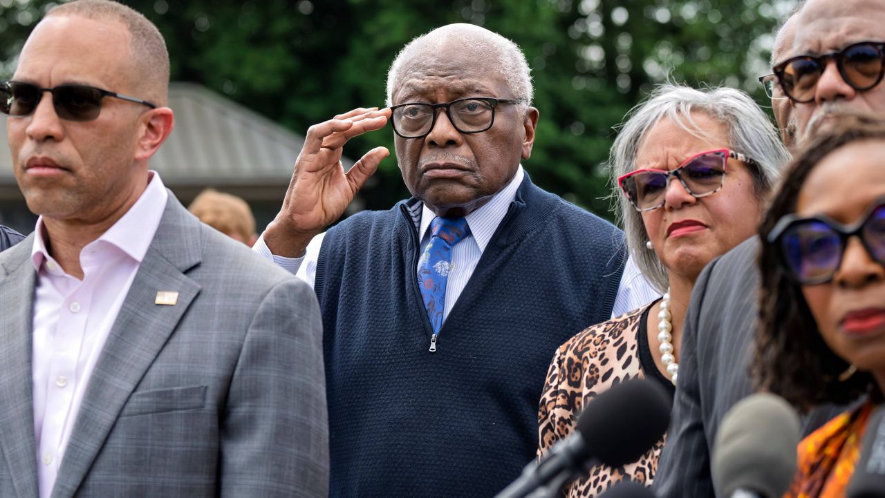 Rep. Jim Clyburn, D-S.C., center, joined by House Minority Leader Hakeem Jeffries, D-N.Y., left, stands with members of the Congressional Black Caucus during an event outside the Capitol in Washington, Tuesday, May 19, 2026. (AP Photo/J. Scott Applewhite)
