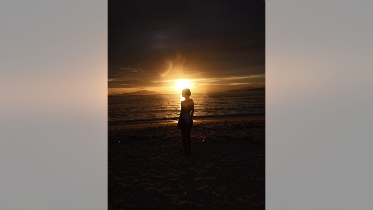 Julianne Hough on the beach at sunset