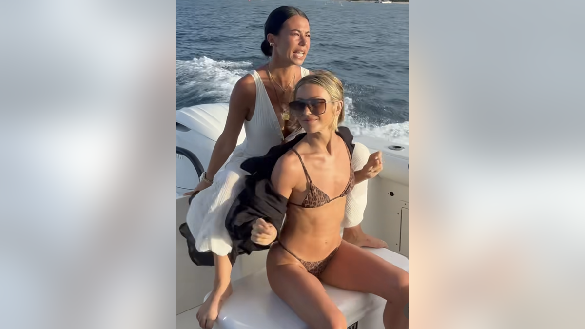 Julianne Hough sits in boat with friend