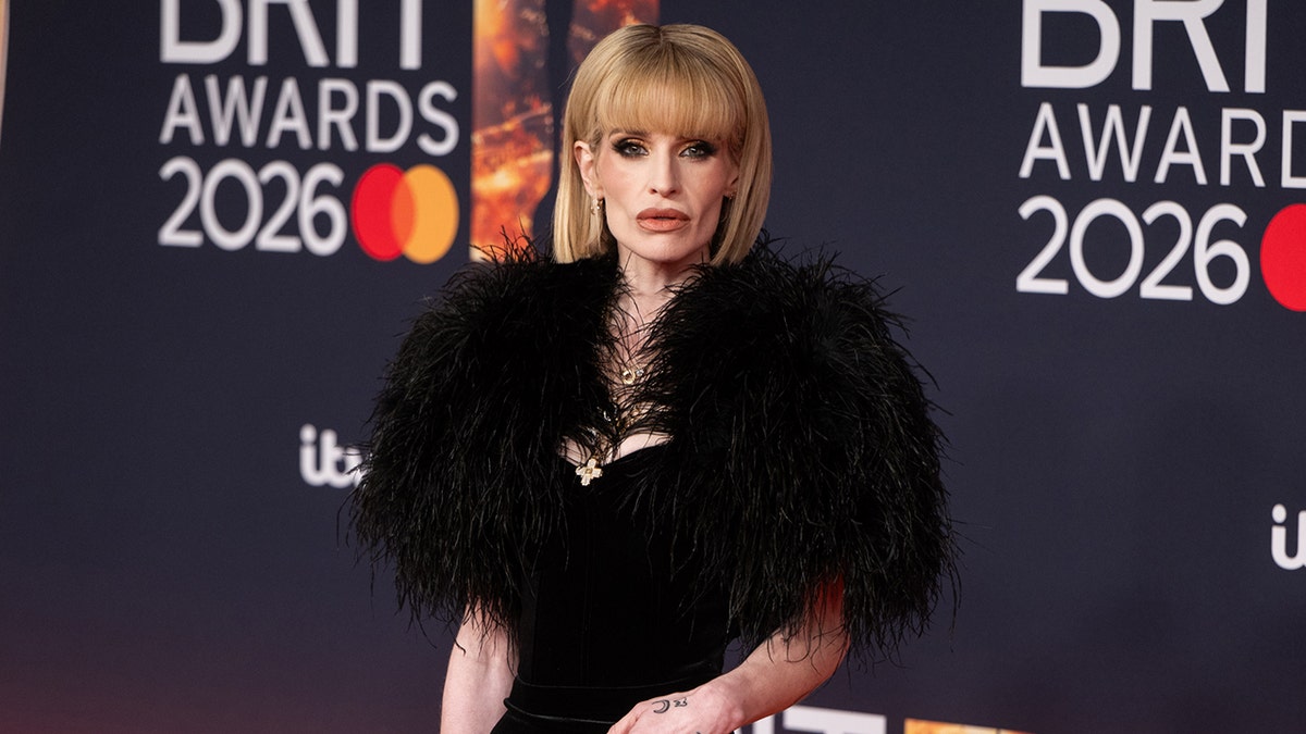 Kelly Osbourne standing at The BRIT Awards event in Manchester, England