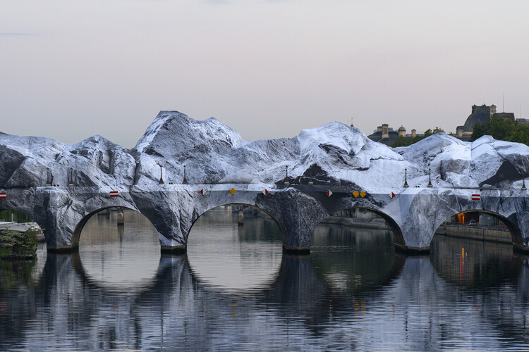 Street Artist JR Installs an Inflatable Cave on Paris' Pont Neuf in Tribute to Christo and Jeanne-Claude - Image 1 of 22
