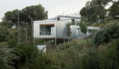 Wood Prefab Panels Cloaked in Galvanized Steel Form a Hillside Home in Barcelona