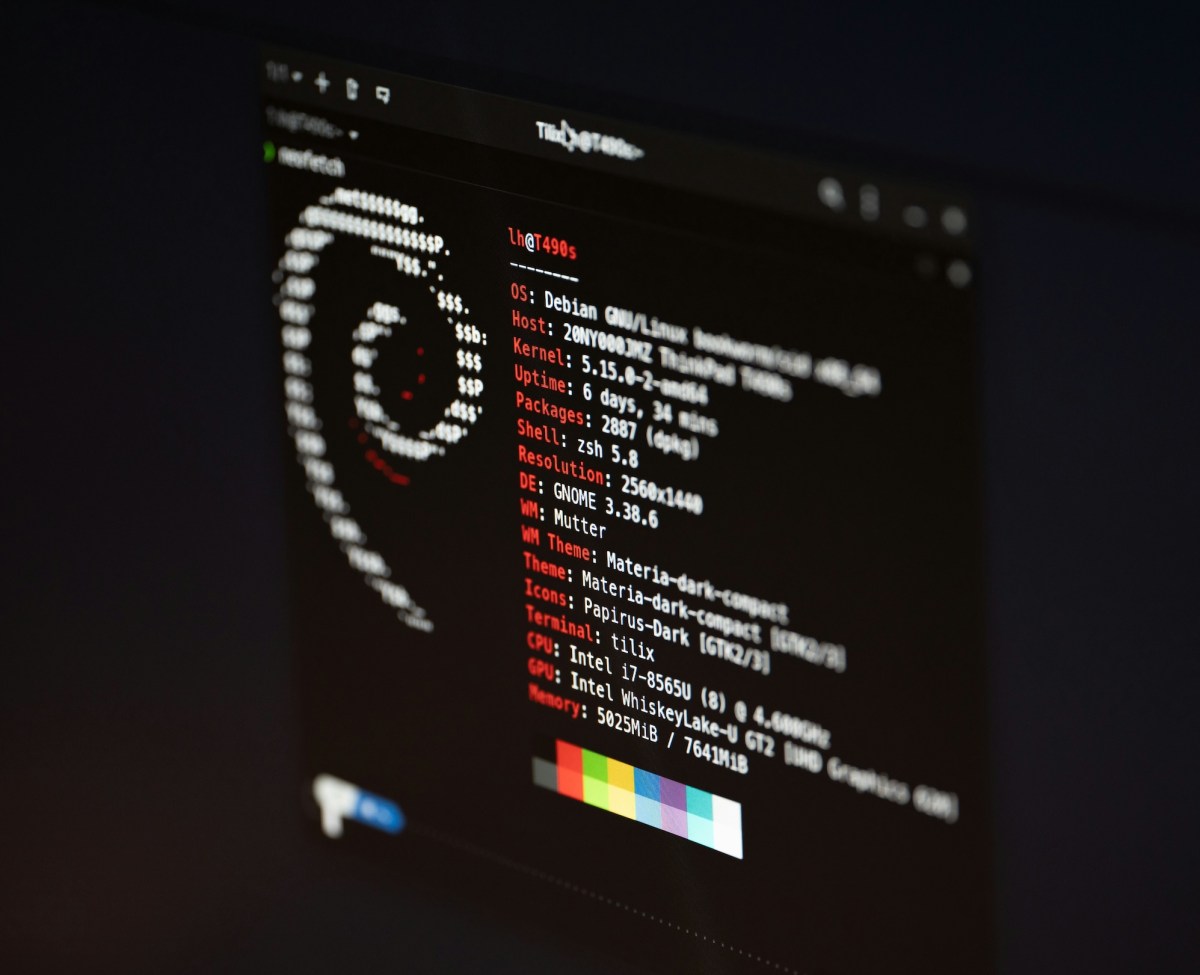 a screenshot of Debian Linux on a black screen with a white terminal font