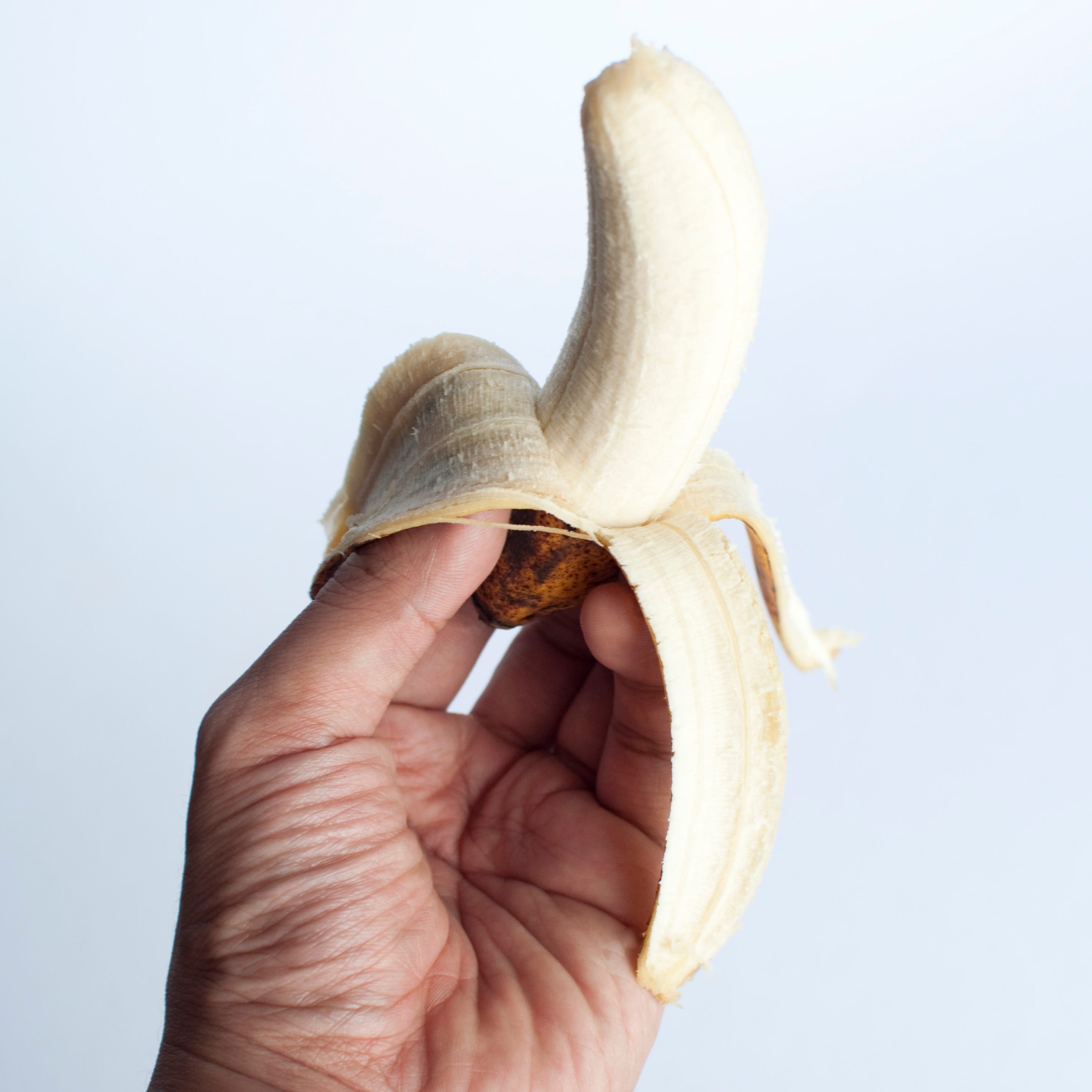 man holding a banana