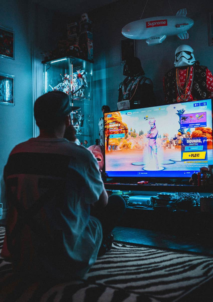 heartbroken man playing video games 