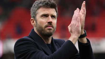 Manchester United manager Michael Carrick applauds the supporters