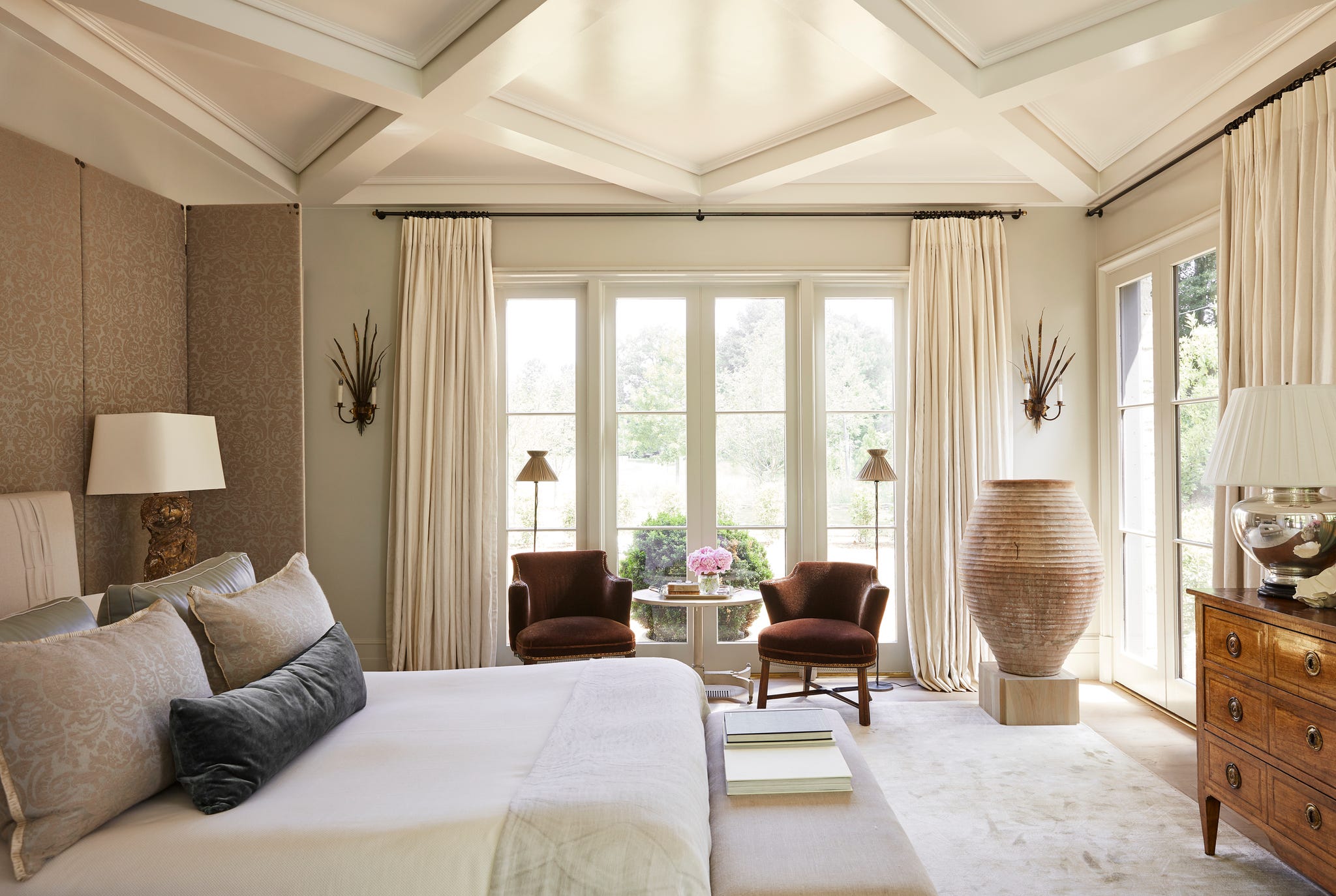 bedroom paint colors pounds birmingham a mostly neutral bedroom with a pair of dark chairs in the window