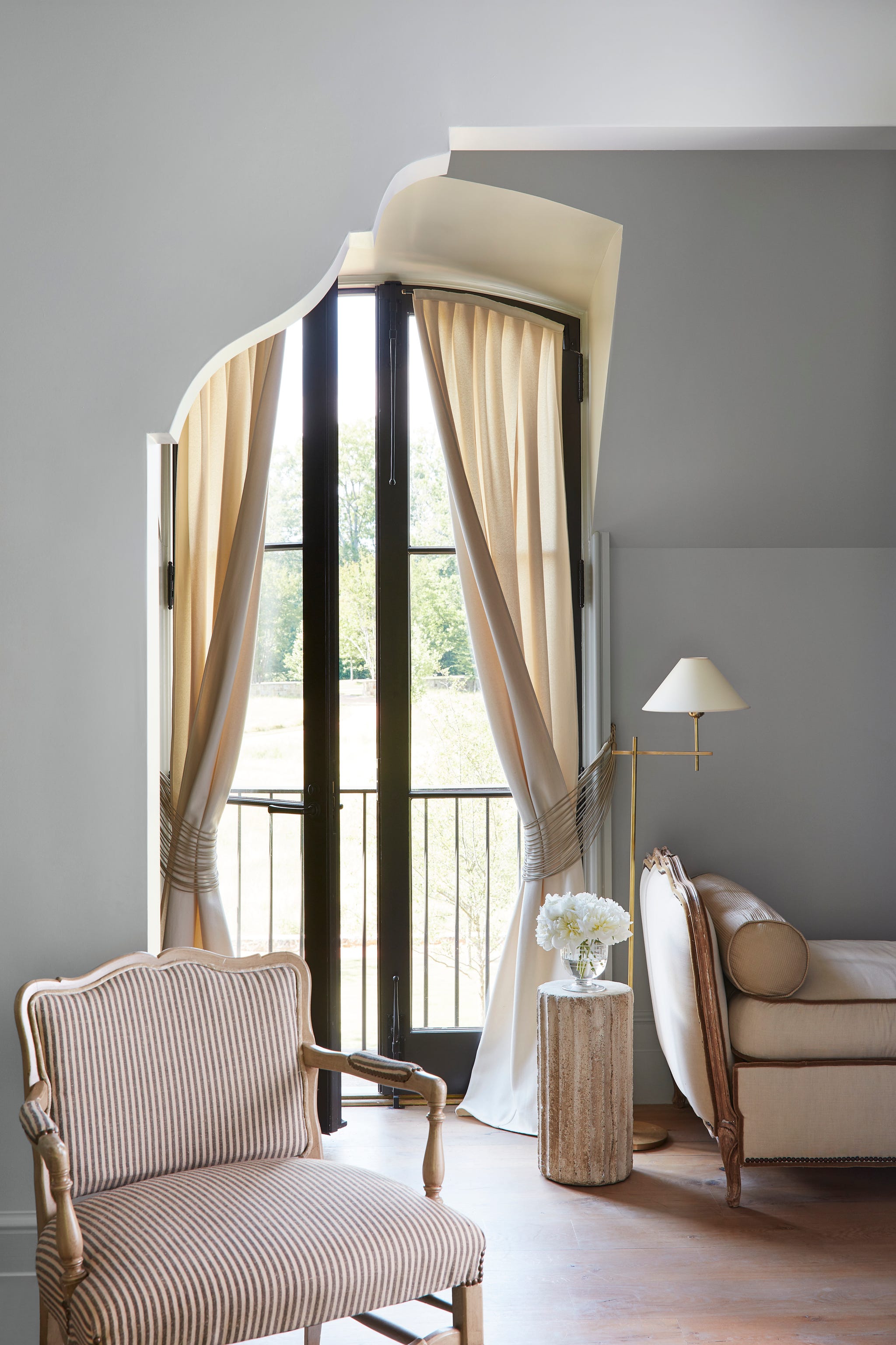 melanie pounds mountain brook house tour guest bedroom in a guest room an antique daybed and chair sit near a window