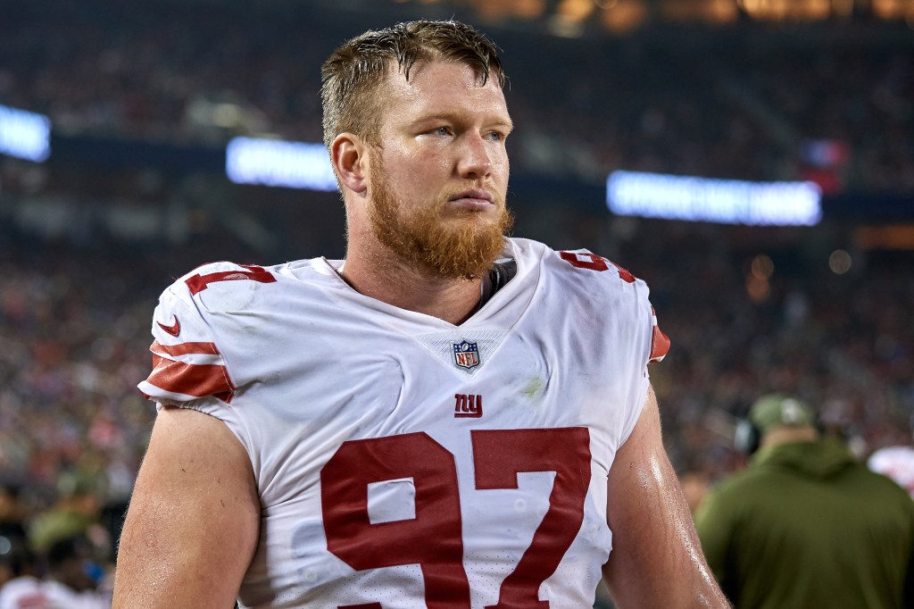 New York Giants defensive end Josh Mauro (97) looks on during a game.