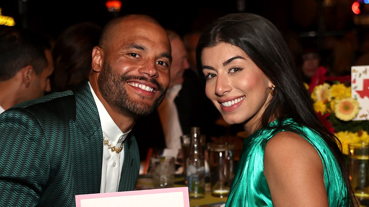Dak Prescott and Sarah Jane Ramos standing together at the Farrah Fawcett Foundation Tex-Mex Fiesta in Dallas