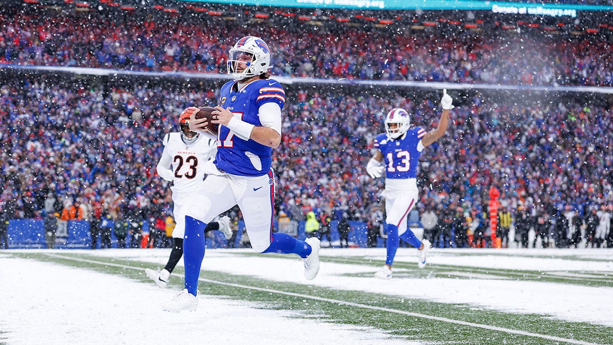 Josh Allen standing on the field in a Buffalo Bills uniform