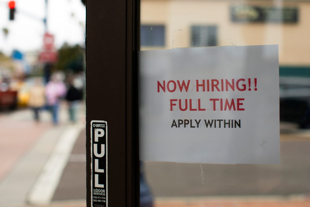 A retail store advertising a full time job on its open door in Oceanside, California, U.S., May 10, 2021. Photo by Mike Bl...