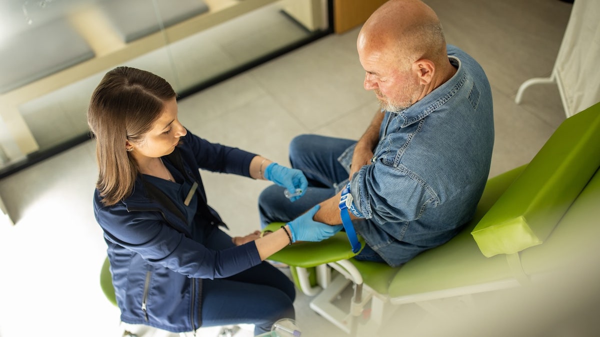 Older man getting Alzheimer's blood test