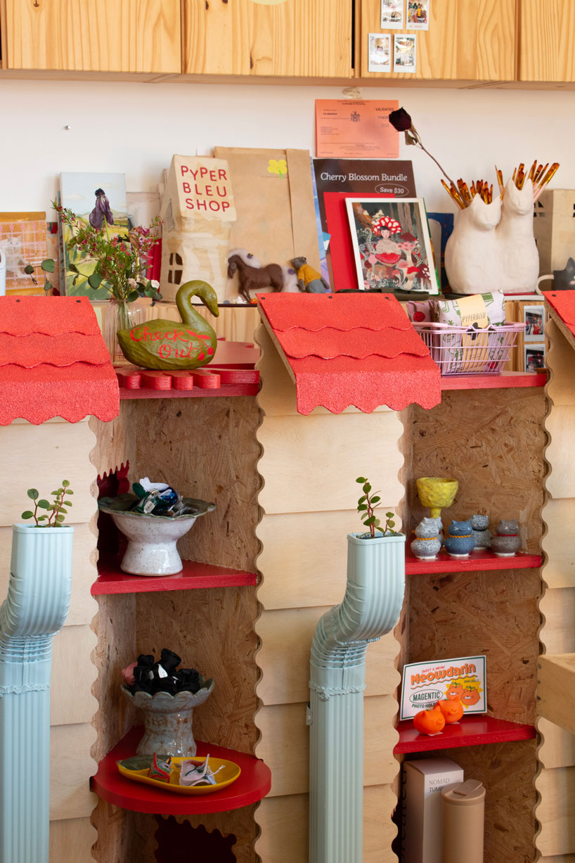 modular timber display rooms reinterpret the checkout counter as an open house facade - 2