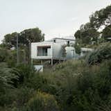 Wood Prefab Panels Cloaked in Galvanized Steel Form a Hillside Home in Barcelona - Photo 1 of 14 -