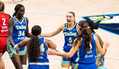 Paige Bueckers leads a huddle with teammates Aziaha James, Alanna Smith, Arike Ogunbowale, and Awak Kuier during the home opener against Atlanta.