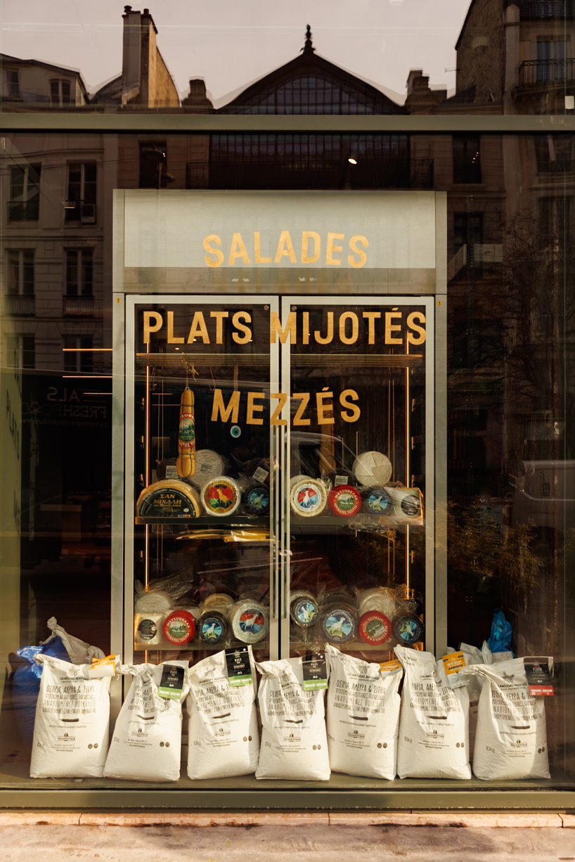 red floor anchors parisian restaurant ypseli with steel and marble textures - 2