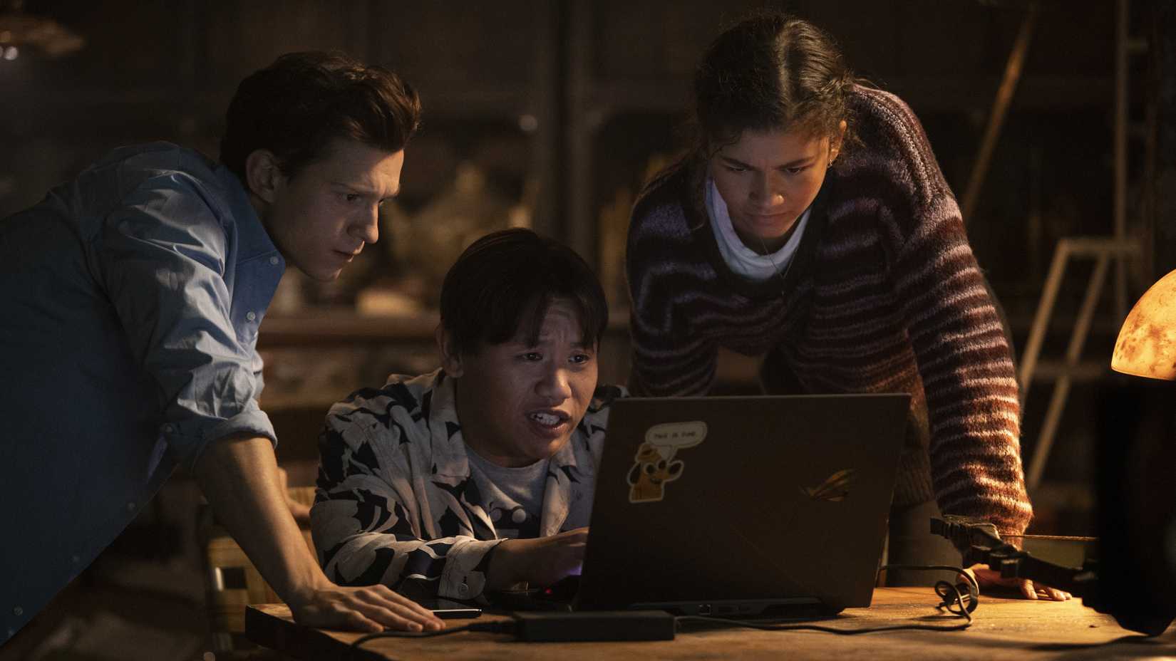 Peter Ned and MJ in front of a laptop in Spider-Man No Way Home