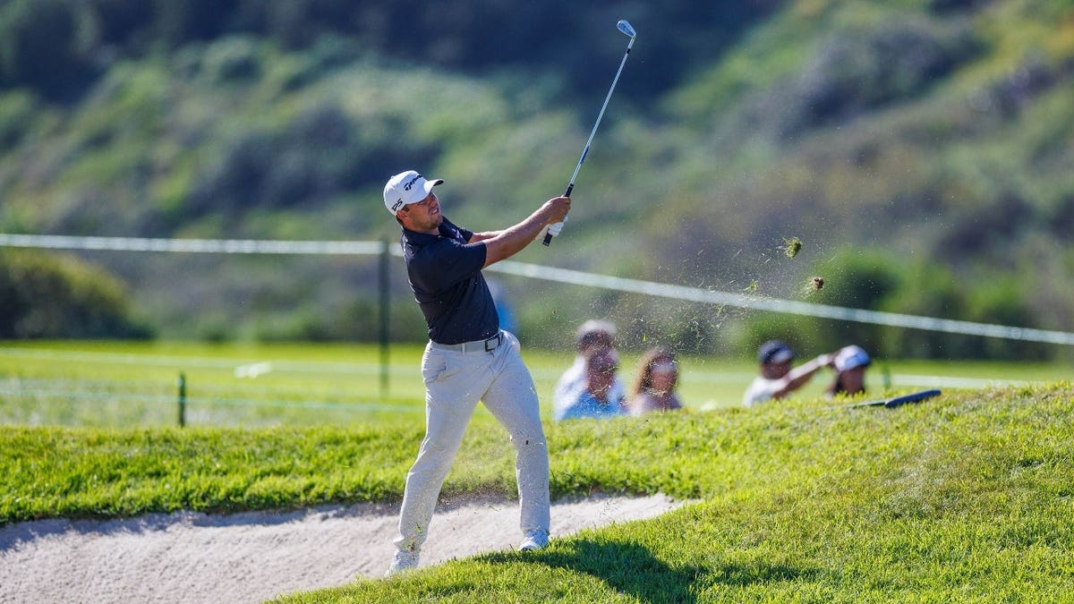 Pierceson Coody hits out of the rough during the 2026 Farmers Insurance Open at Torrey Pines Municipal Golf Course in San Diego.