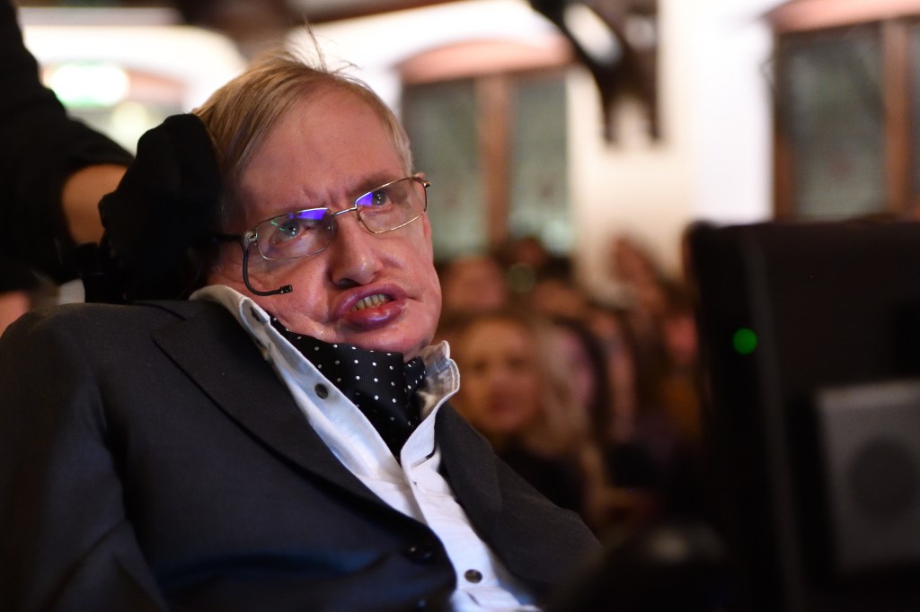 Man with ALS in a wheelchair with a respirator