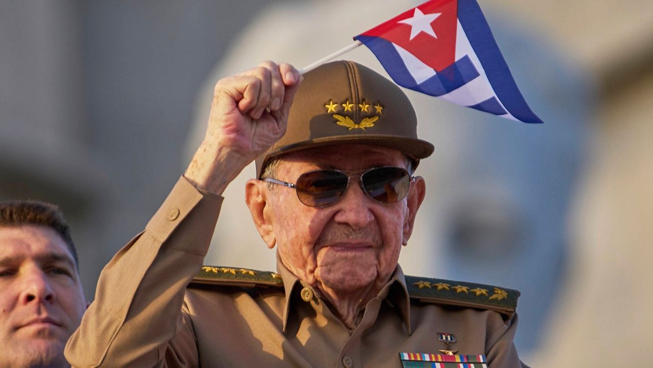 Raul Castro waves a Cuban national flag while attending the May Day parade at Revolution Square in Havana, Thursday, May 1, 2025. (AP Photo/Ramon Espinosa, File)