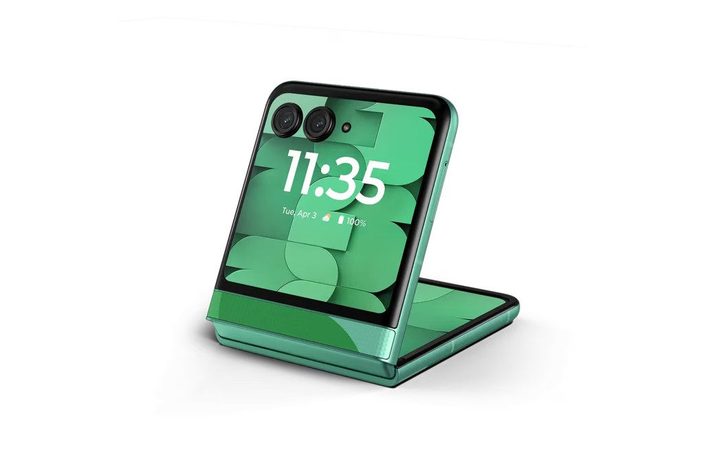 Green Motorola Razr Plus 2023 with the time 11:35 and date Tue, Apr 3 displayed on its cover screen.
