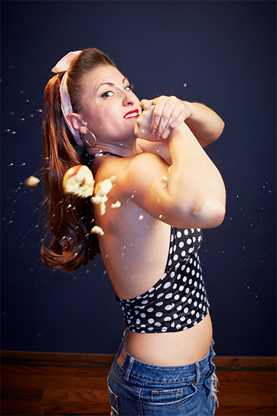woman with apple on arm