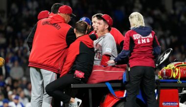 Cincinnati Reds manager Terry Francona, left, talks to relief pitcher Emilio Pagán, as he leaves the field after an injury during the ninth inning of a baseball game against the Chicago Cubs in Chicago, Tuesday, May 5, 2026. (AP Photo/Nam Y. Huh)