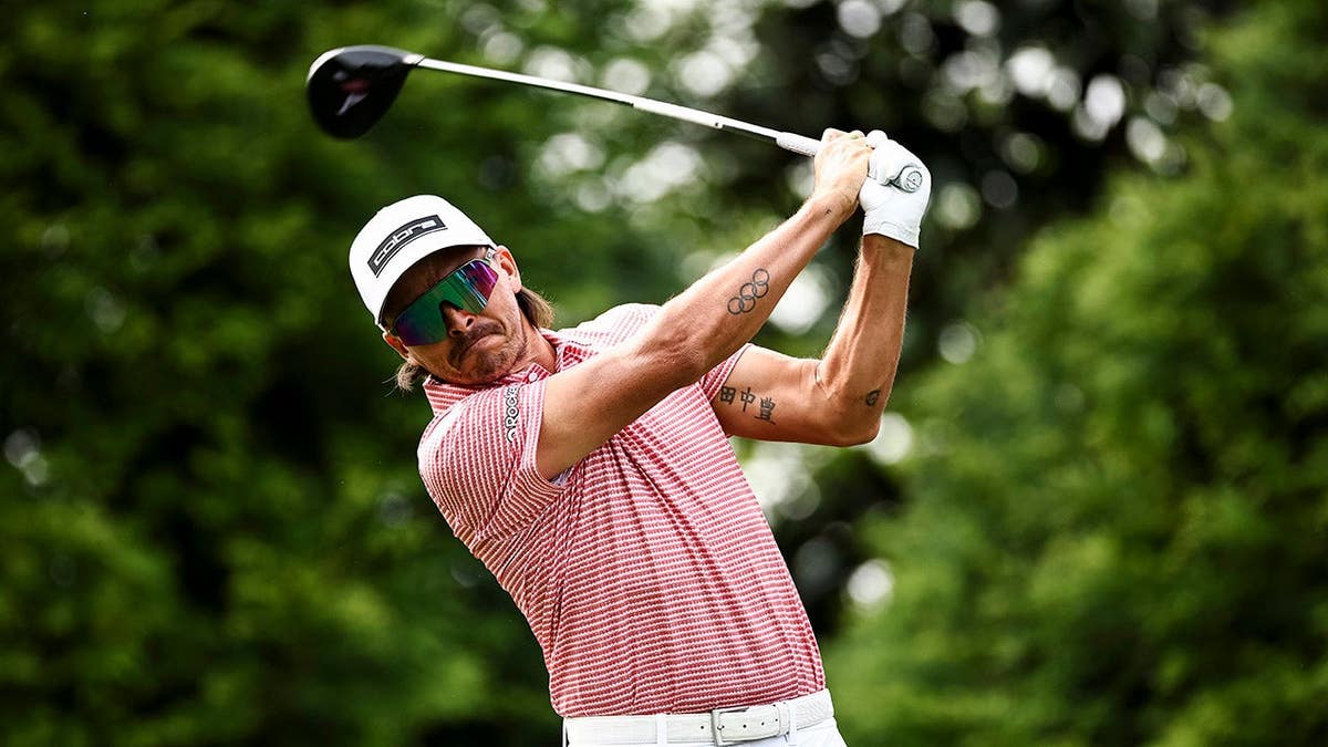 Rickie Fowler hitting a tee shot on the 16th hole at Quail Hollow Country Club