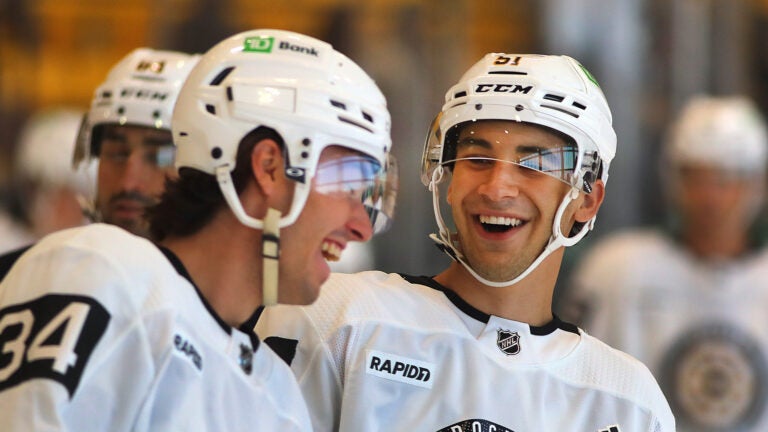 The Boston Bruins held their development camp at Warrior Ice Arena. Frederic Brunet(left) and Matt Poitras share a light moment.