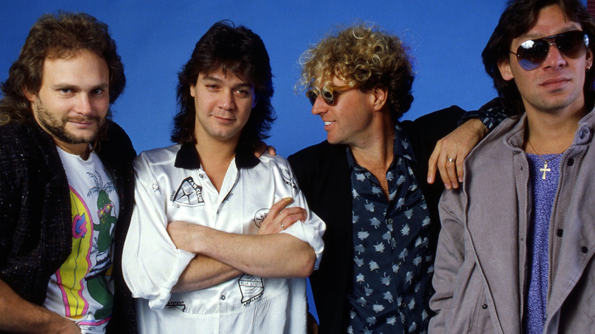 Guitarist Eddie Van Halen, bassist Mark Anthony, singer Sammy Hagar, and drummer Alex Van Halen posing at Eddie's house studio.