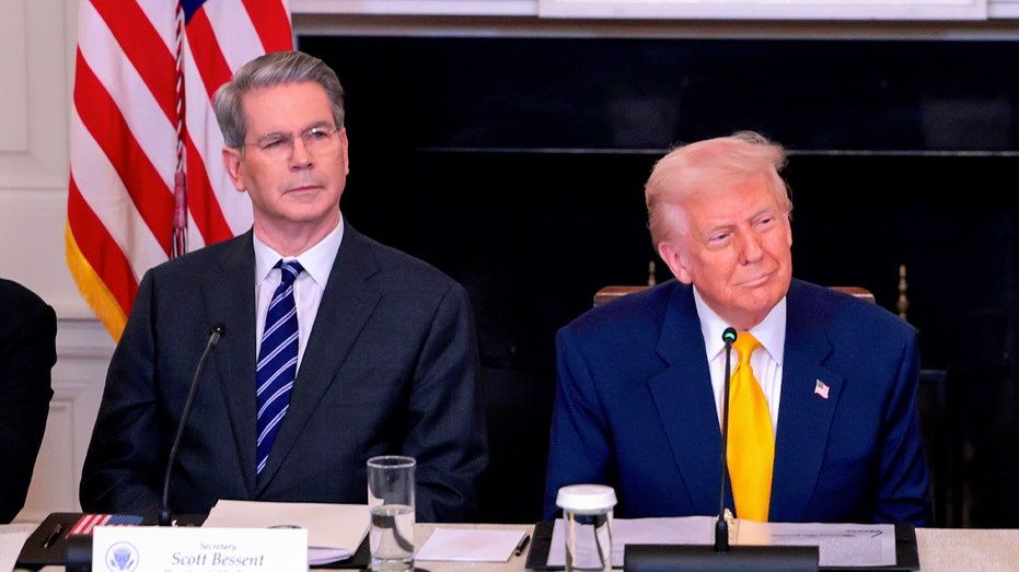 Scott Bessent sits next to Donald Trump