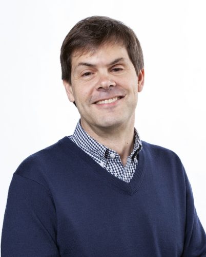 headshot of a man smiling