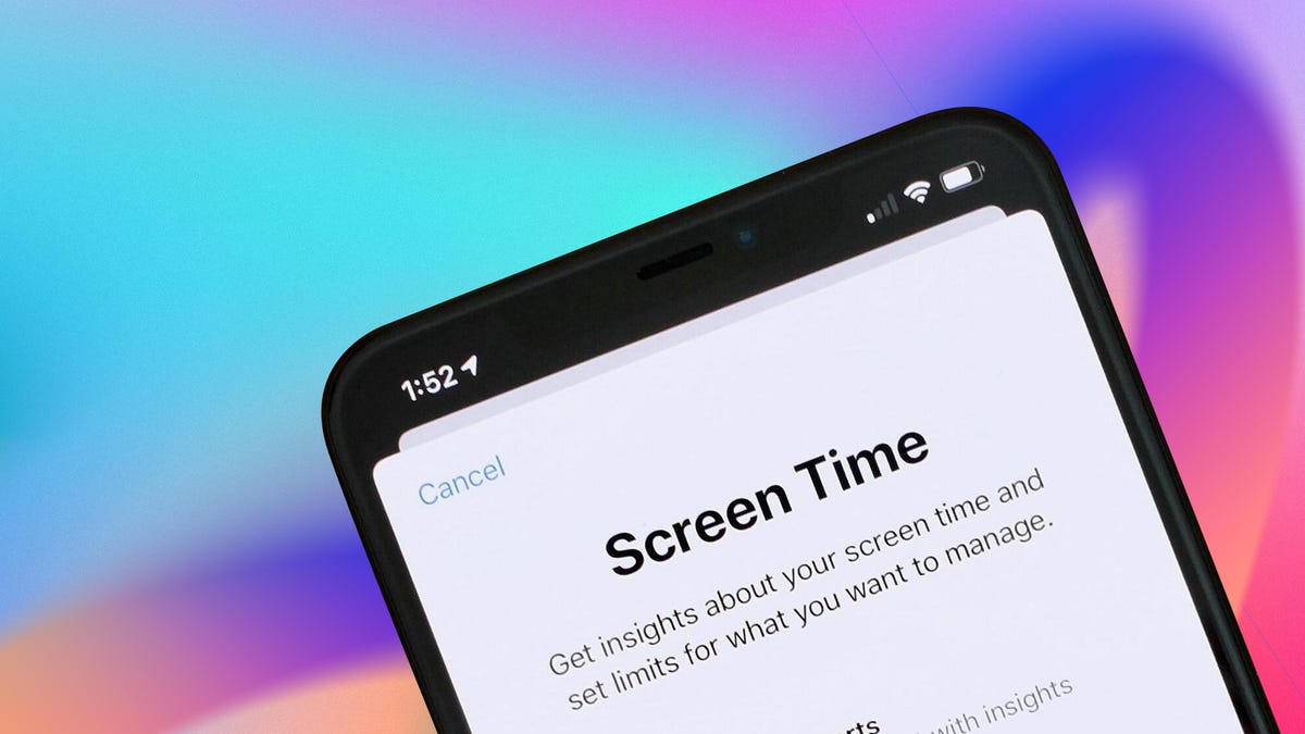 a screen time page displayed on a phone on a rainbow background