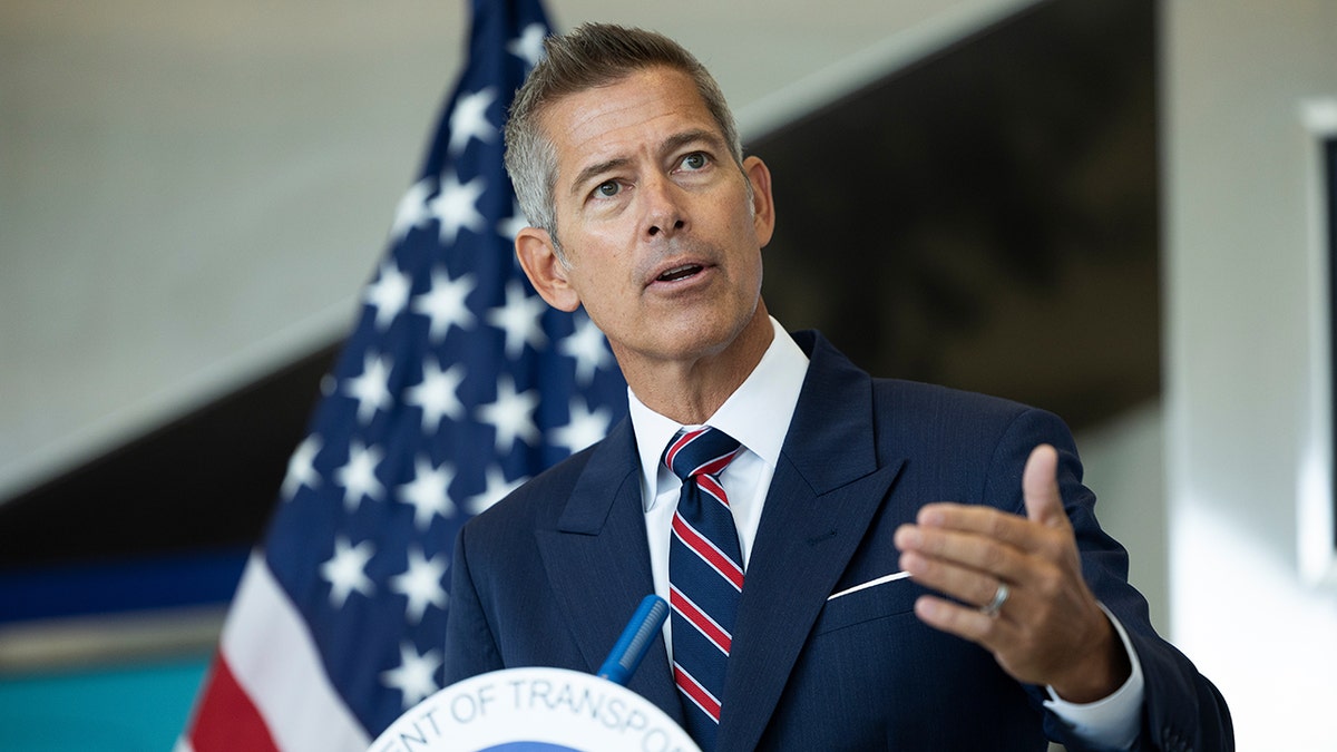 Sean Duffy speaking at a news conference at Philadelphia International Airport