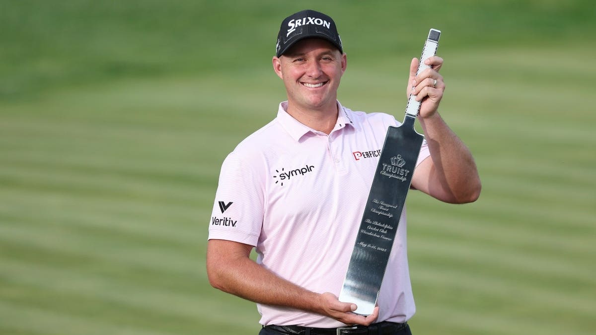 Sepp Straka poses for a photo with the trophy after winning the PGA TOUR's 2025 Truist Championship at Philadelphia Cricket Club in Pennsylvania.