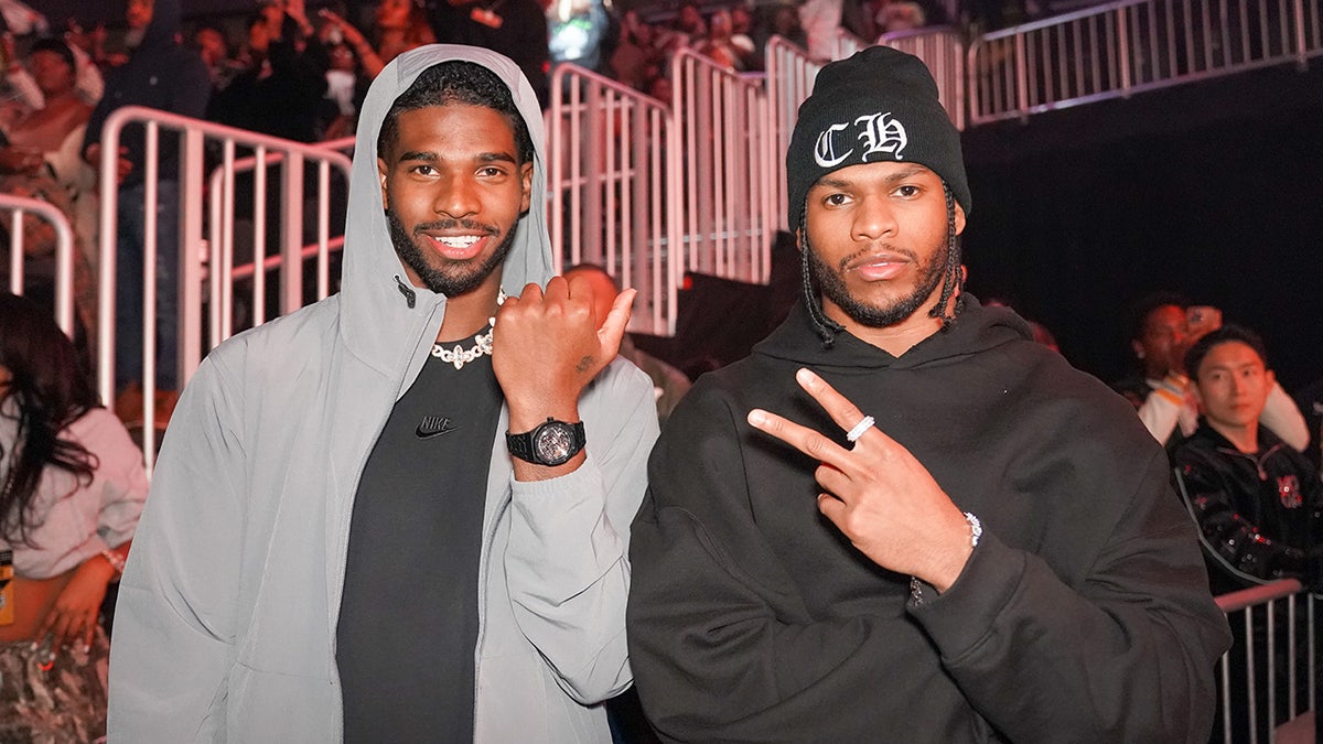 Shedeur Sanders and Shilo Sanders standing together at State Farm Arena in Atlanta