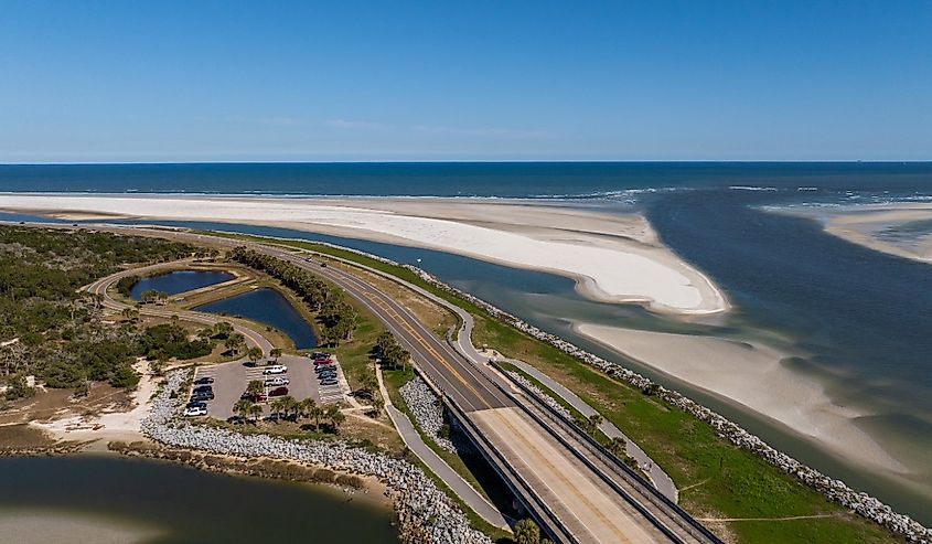Aerial shot of Highway A1A running through Jacksonville, flanked by the glistening Fort George River and Heckscher Drive.