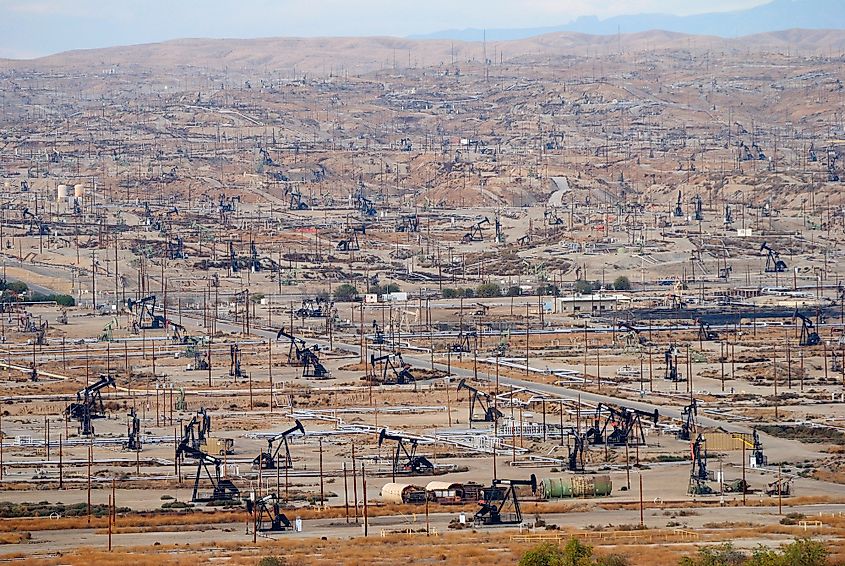 Oil field with derrick pumps outside Bakersfield, California