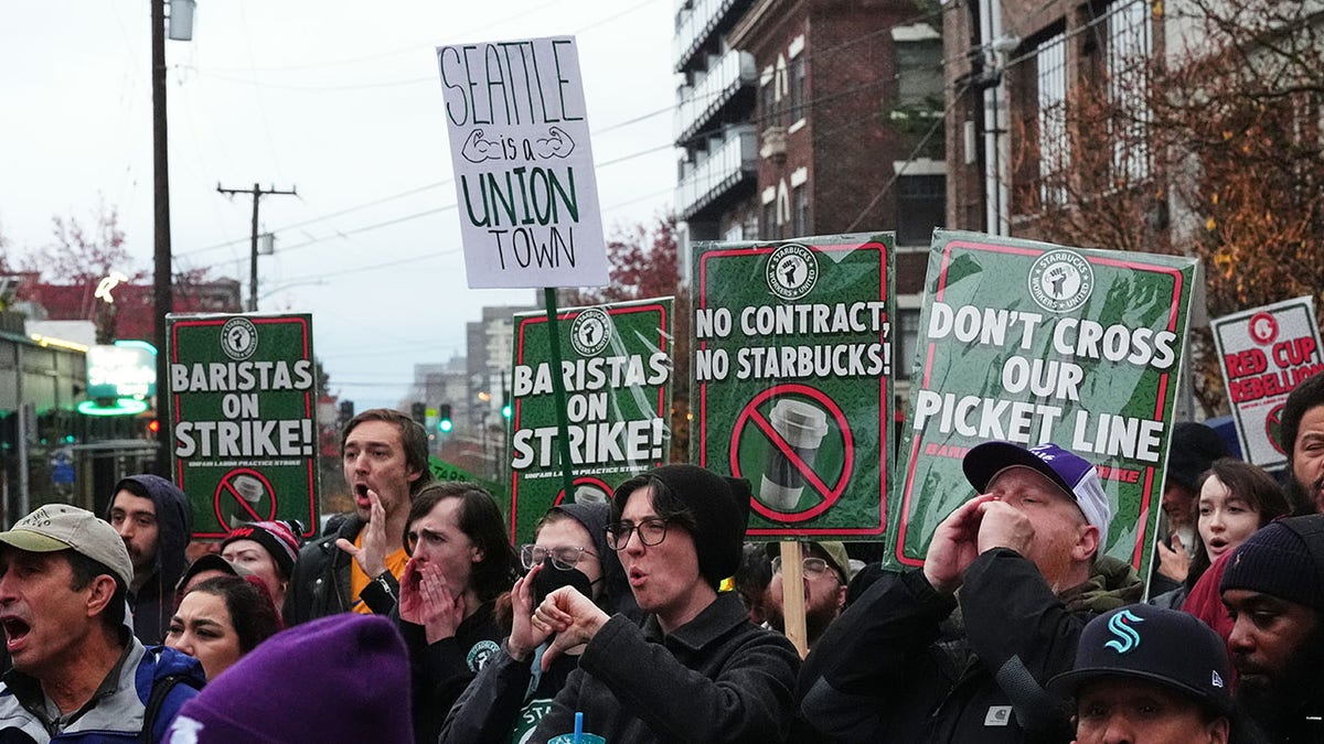 Starbucks strikers holding signs.