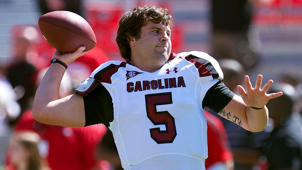 South Carolina quarterback Stephen Garcia warming up on the field at Sanford Stadium