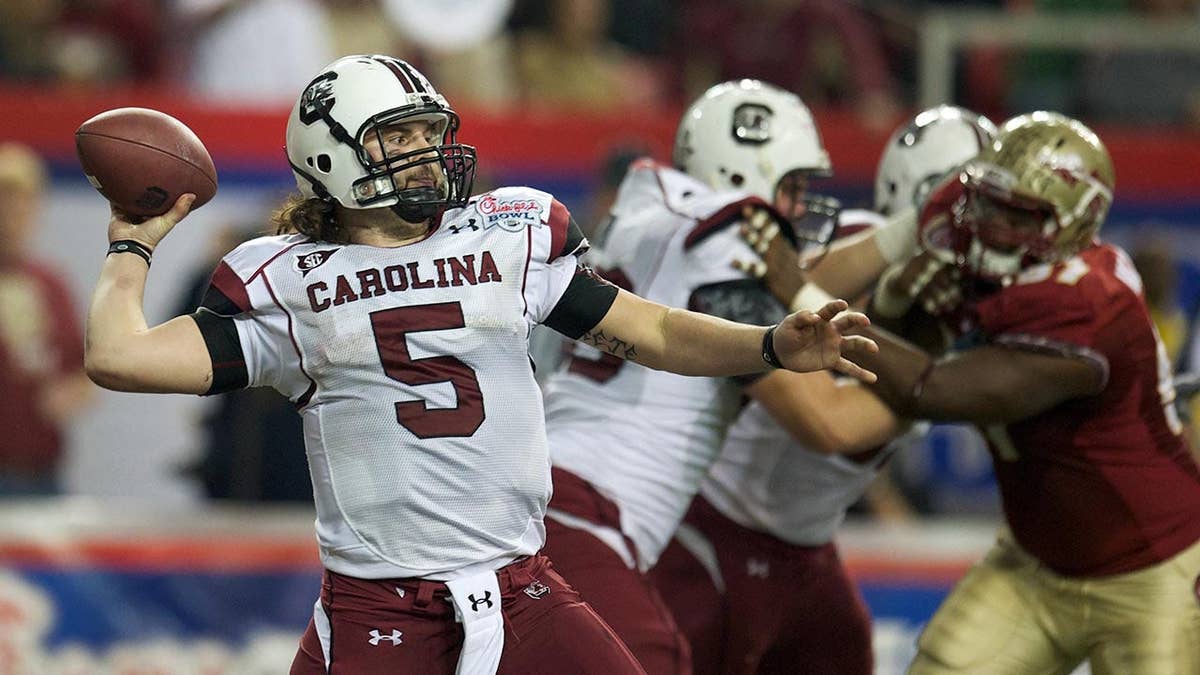 South Carolina quarterback Stephen Garcia throwing a pass during a football game.
